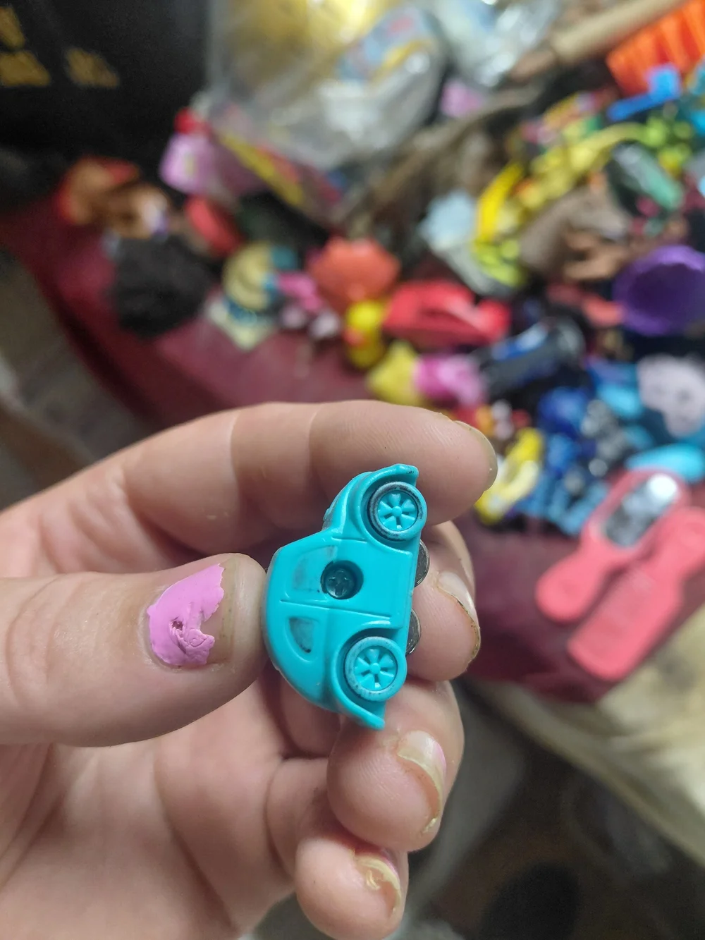 light-blue plastic toy Volkswagen Beetle (bug) car. [1] (https://boonsartshop.co